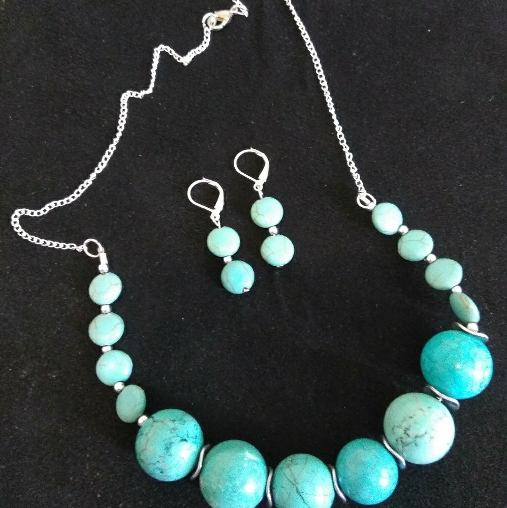Turquoise and silver necklace and earring set.